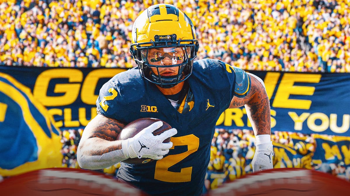 Blake Corum touchdowns help fans celebrate on field at Michigan Stadium