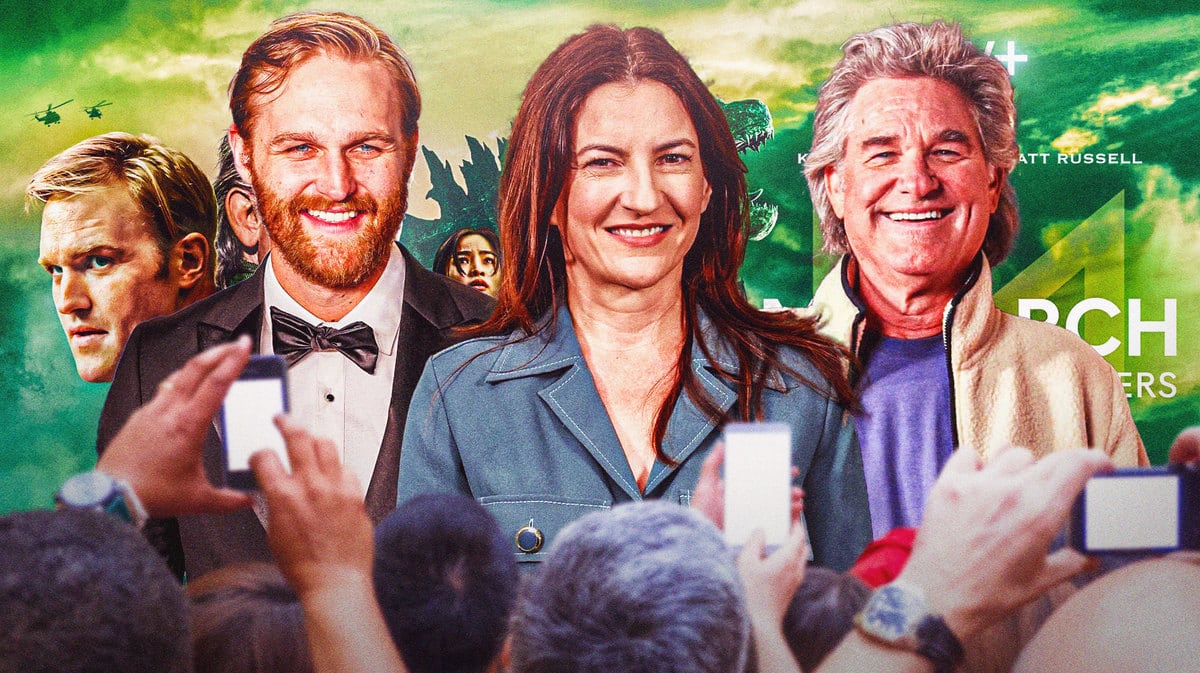 Wyatt Russell, Tory Tunnell, and Kurt Russell in front of Monarch: Legacy of Monsters poster.