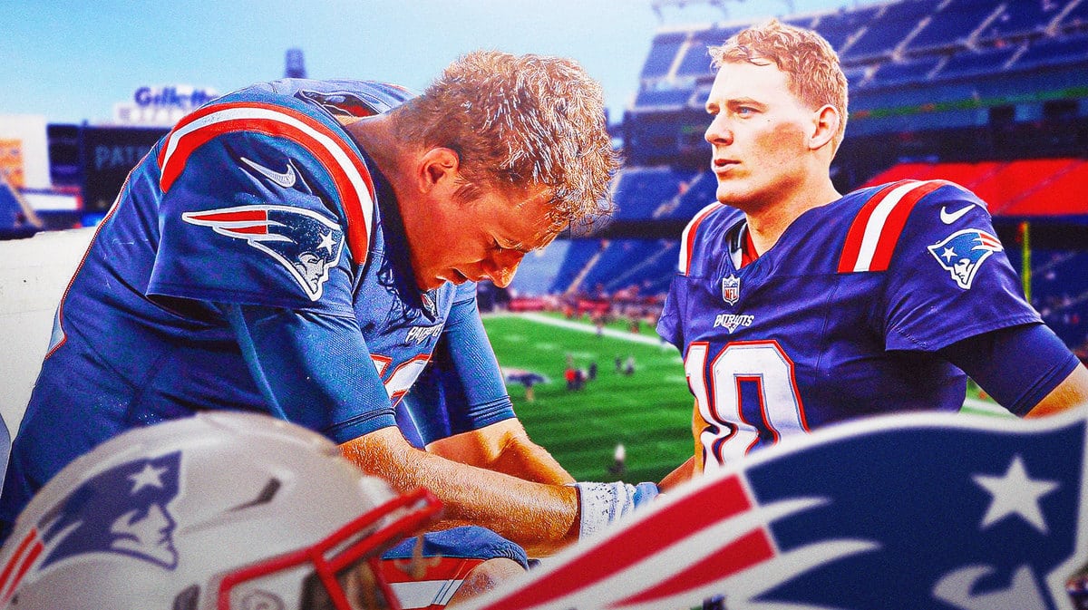 Patriots' Mac Jones sitting down on an NFL sideline looking serious