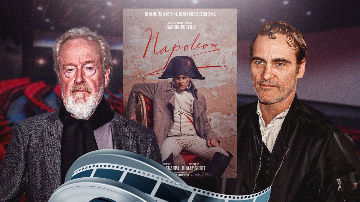 Ridley Scott and Joaquin Phoenix in front of Napoleon poster.