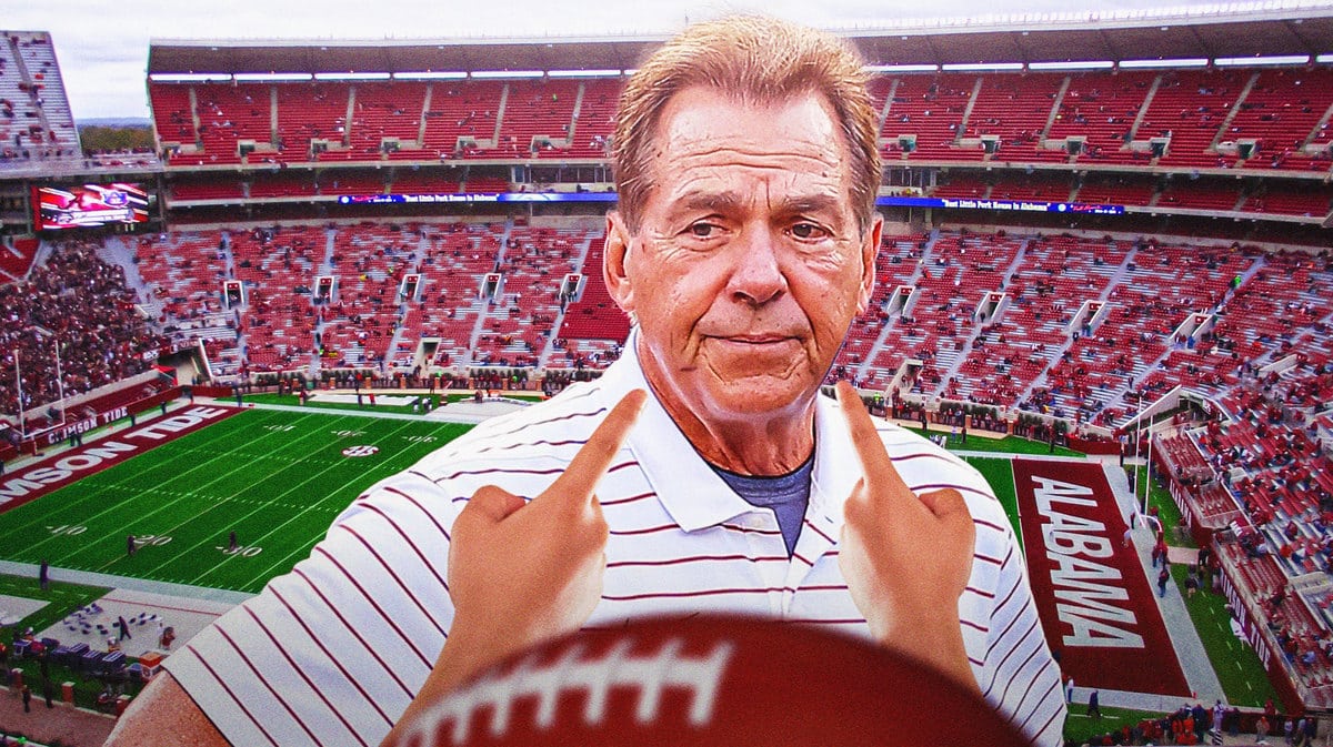 Nick Saban pointing at his eye