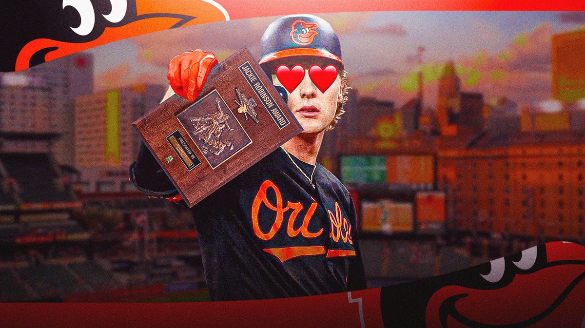The Baltimore Orioles' Gunnar Henderson holding the AL Rookie of the Year award