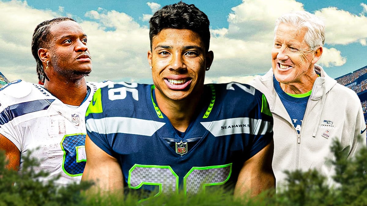 Seahawks' Pete Carroll, Zach Charbonnet smiling. Kenneth Walker looking serious