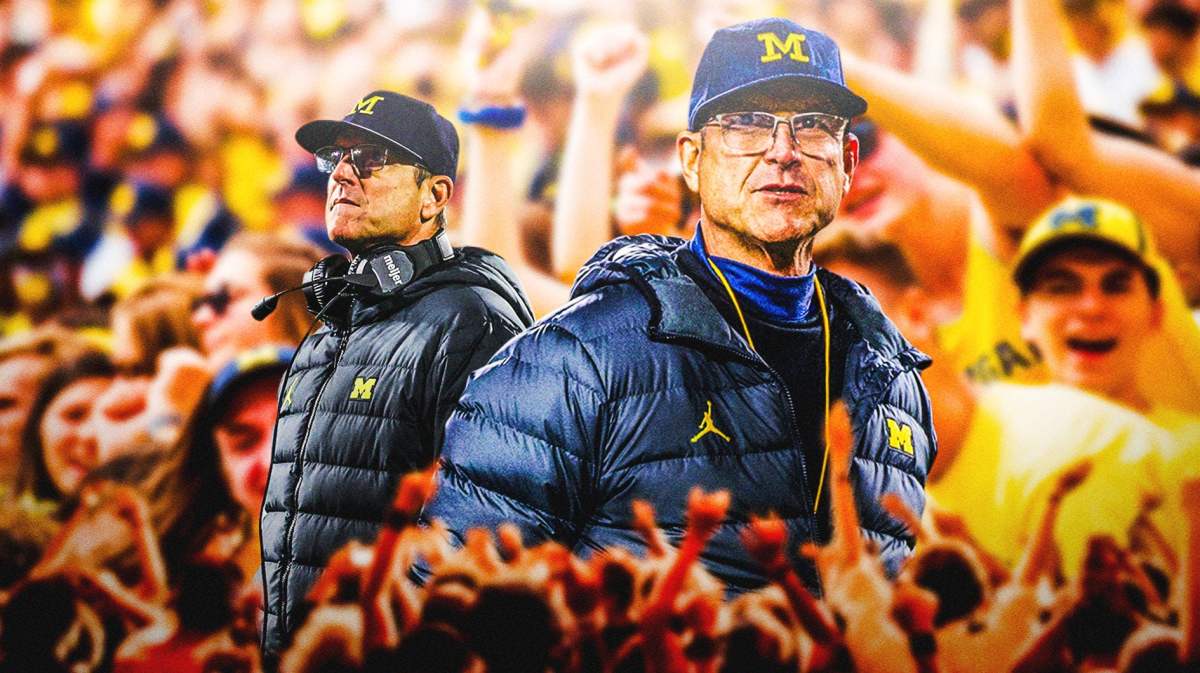 Michigan coach Jim Harbaugh in the foreground, being applauded by fans and players in the background.
