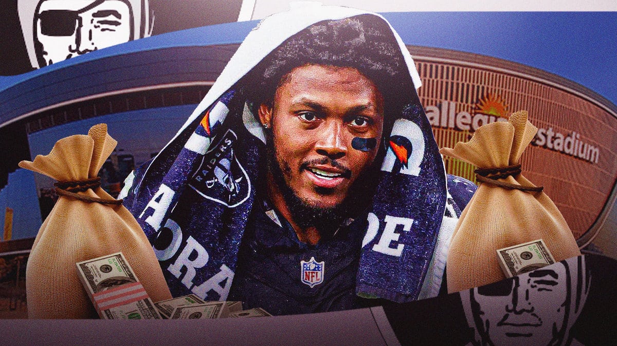 Josh Jacobs with money bags around him