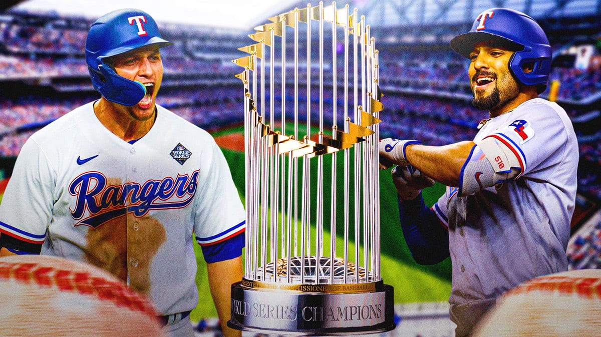 Rangers' Corey Seager, Rangers' Marcus Semien with the World Series trophy in front