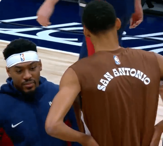 Nuggets rookie Jalen Pickett doing a double take after shaking hands with Victor Wembanyama