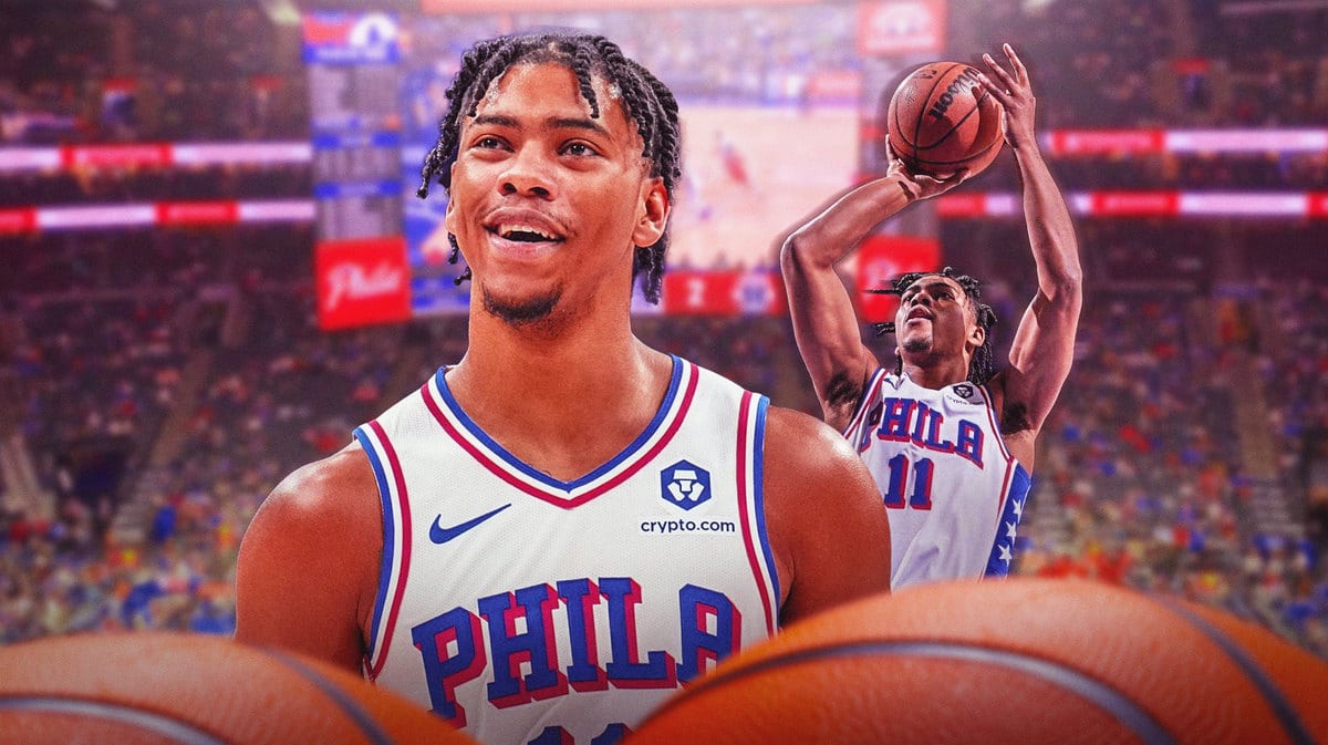 Sixers gaurd Jaden Springer looking happy and shooting the ball