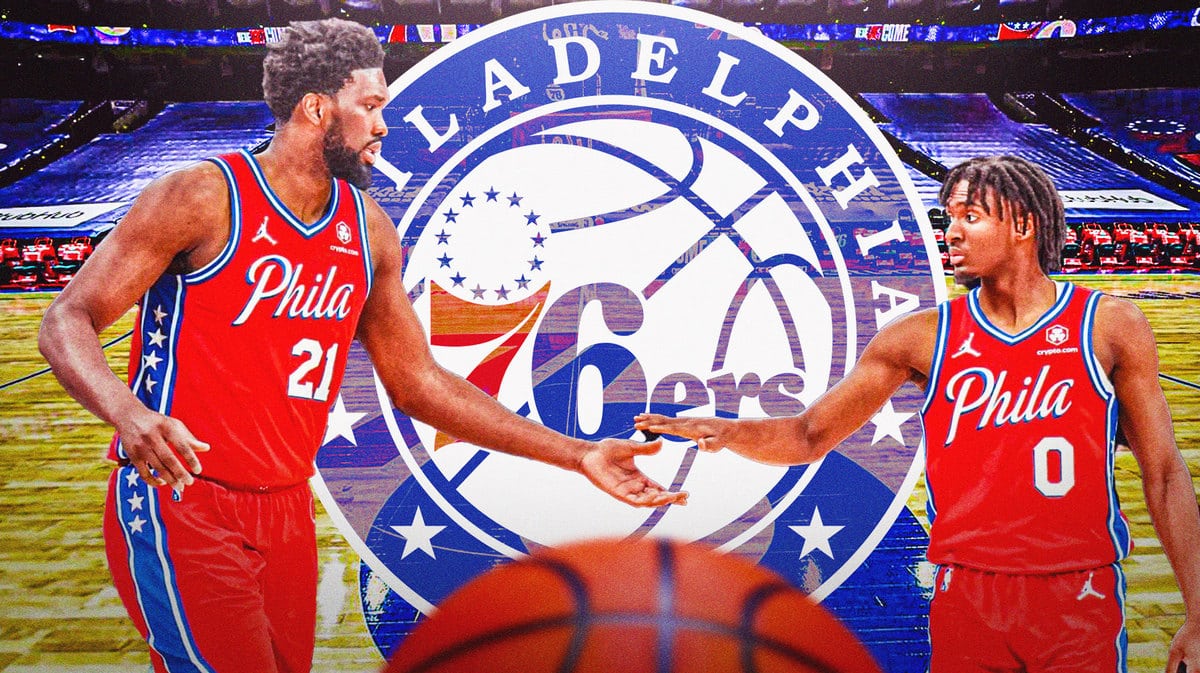 Sixers players Joel Embiid and Tyrese Maxey high-fiving