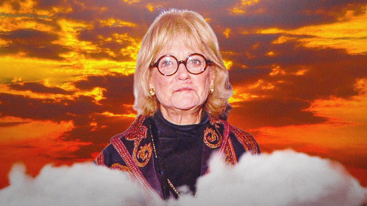Actress Suzanne Shepherd with clouds behind her.