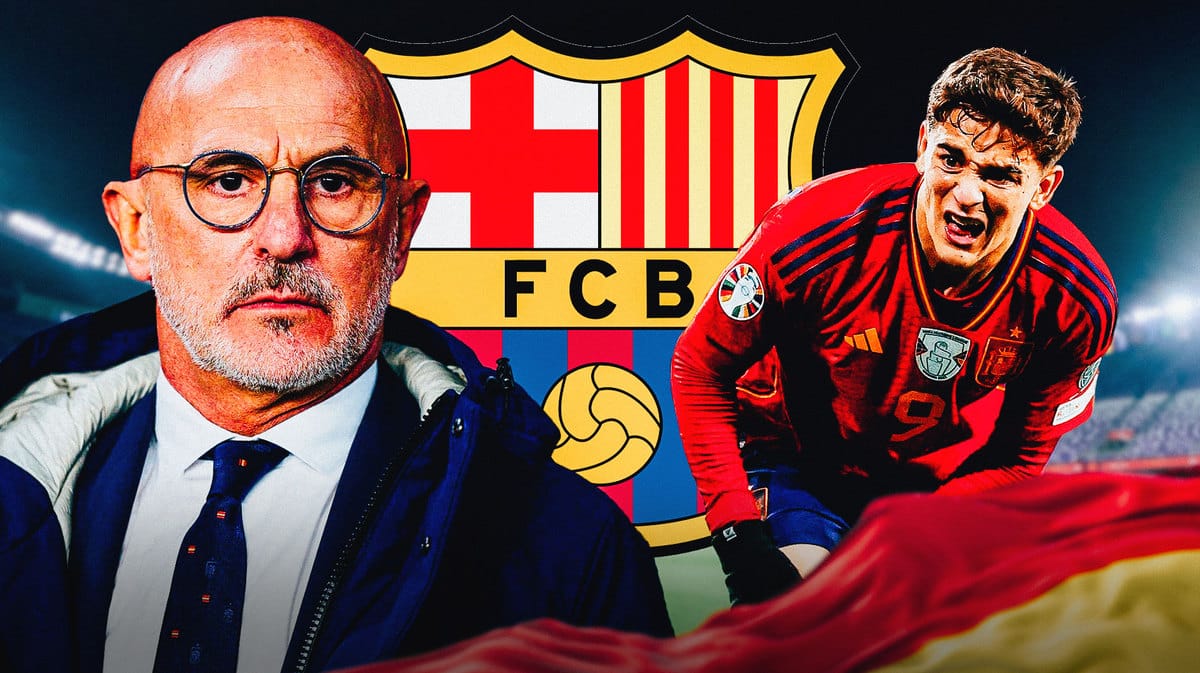 Luis de la Fuente and Gavi in front of the Barcelona logo