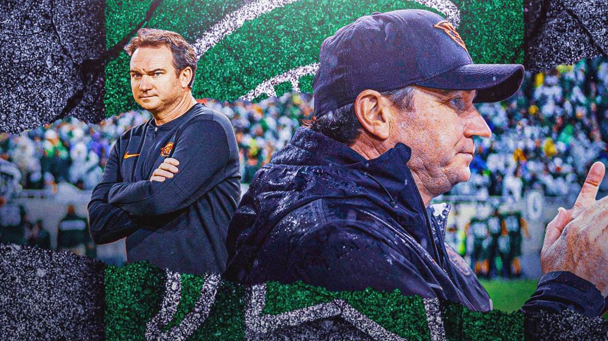 Oregon State head coach Jonathan Smith in the foreground. In the background, a Michigan State logo.