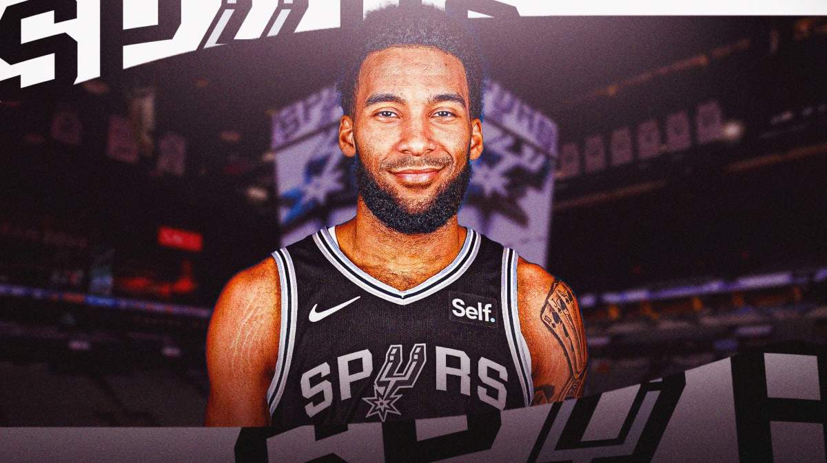 Julian Champagnie with the Spurs arena in the background