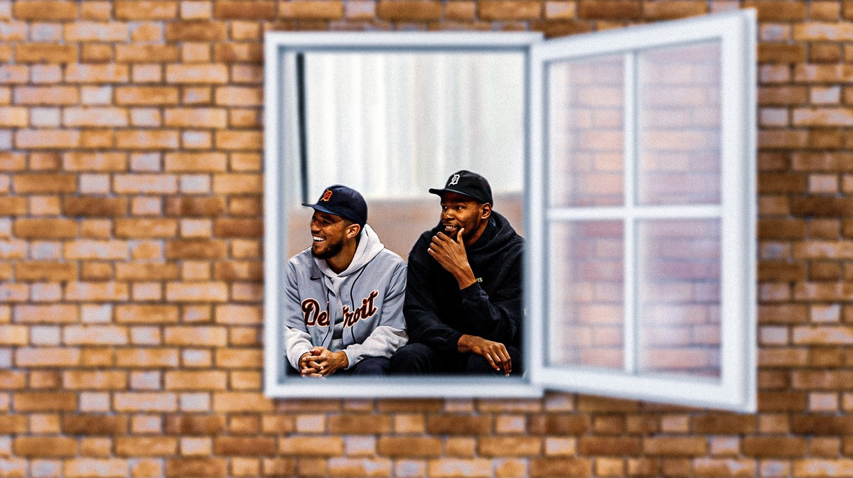 Suns' Kevin Durant, Suns' Devin Booker looking out a window