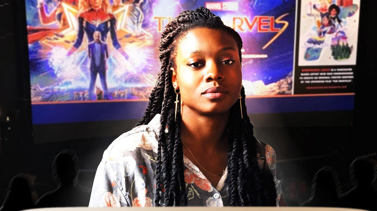 Nia DaCosta with The Marvels on a screen behind her.