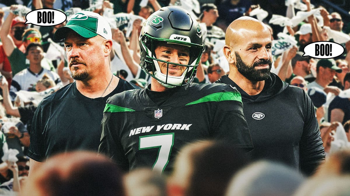 Jets' Tim Boyle, Robert Saleh and Nathaniel Hackett standing together at MetLife Stadium. Jets fans booing loudly