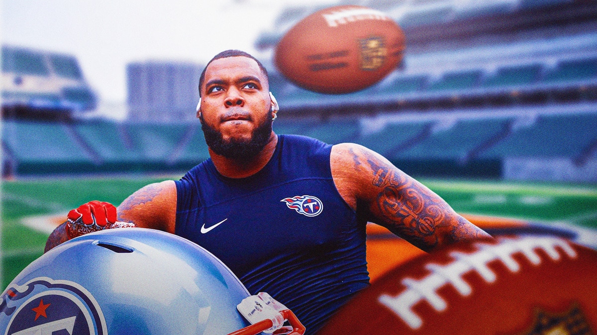Titans' Jeffery Simmons catching a football
