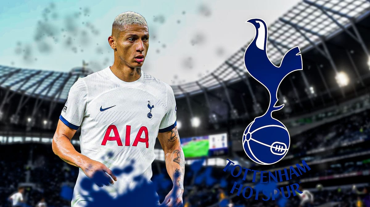 Richarlison in front of the Tottenham logo
