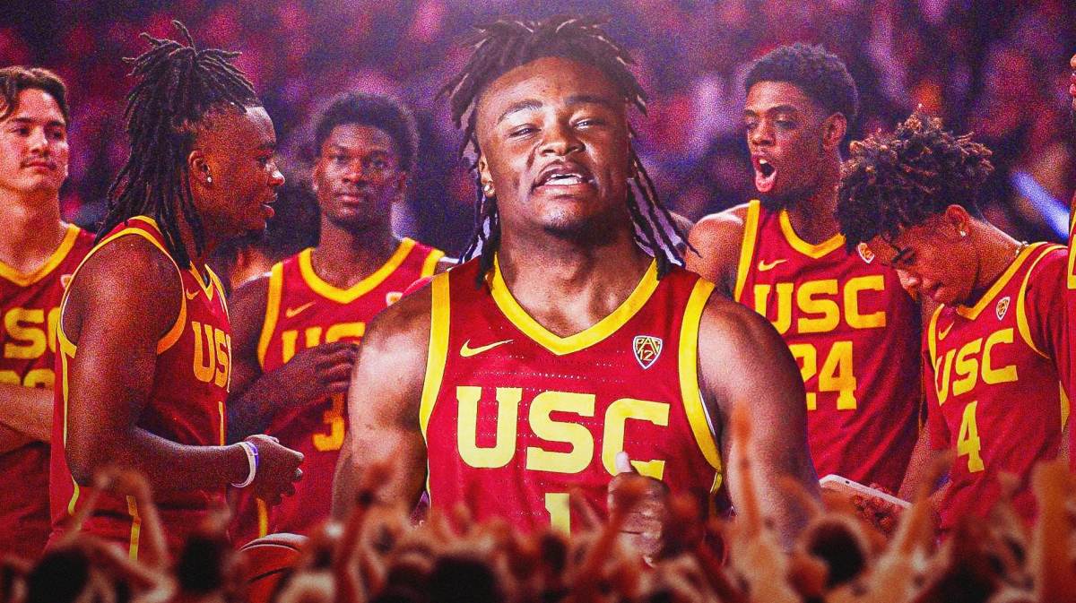 USC's Isaiah Collier in the foreground and other players in the background celebrating.