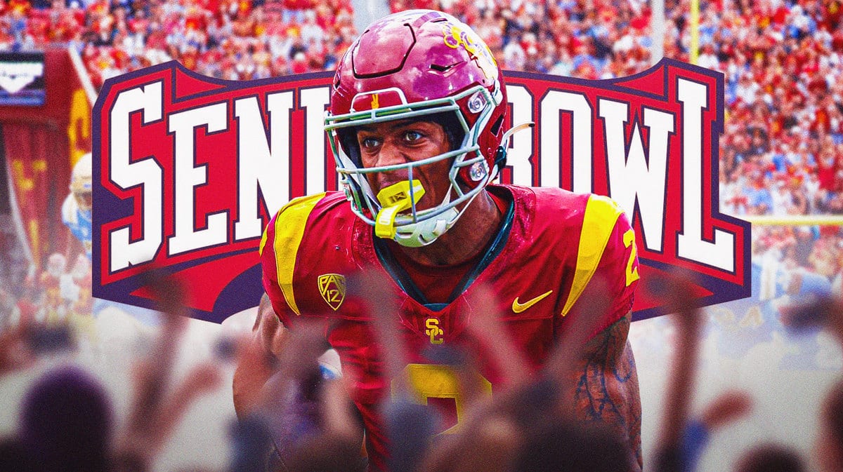 Photo: Brenden Rice in USC football jersey in action with Senior Bowl logo behind him