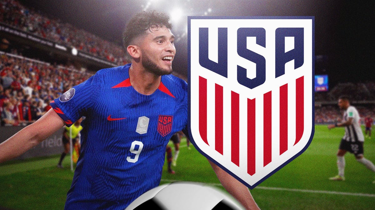 Ricardo Pepi celebrating in front of the USMNT logo