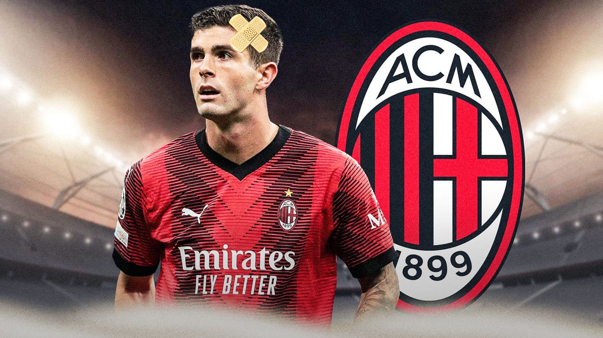 Christian Pulisic injured in front of the AC Milan logo