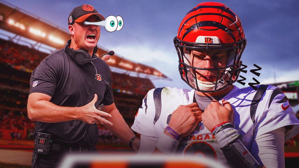 Cincinnati Bengals head coach Zac Taylor looking at a sleeping Joe Burrow