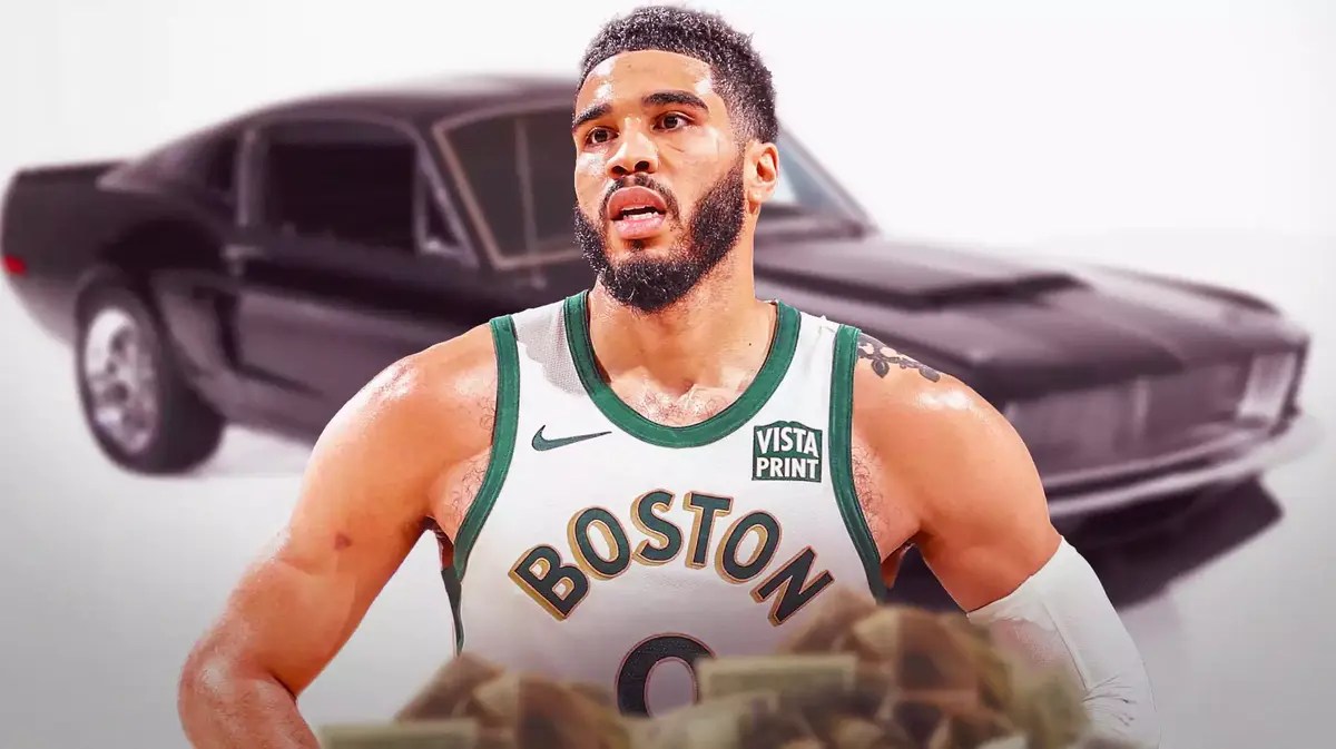 Jayson Tatum in front of a car from his collection.