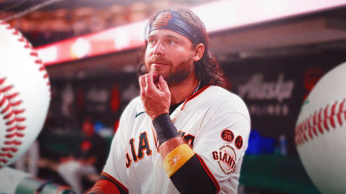 Giants' Brandon Crawford sitting in an MLB dugout looking serious