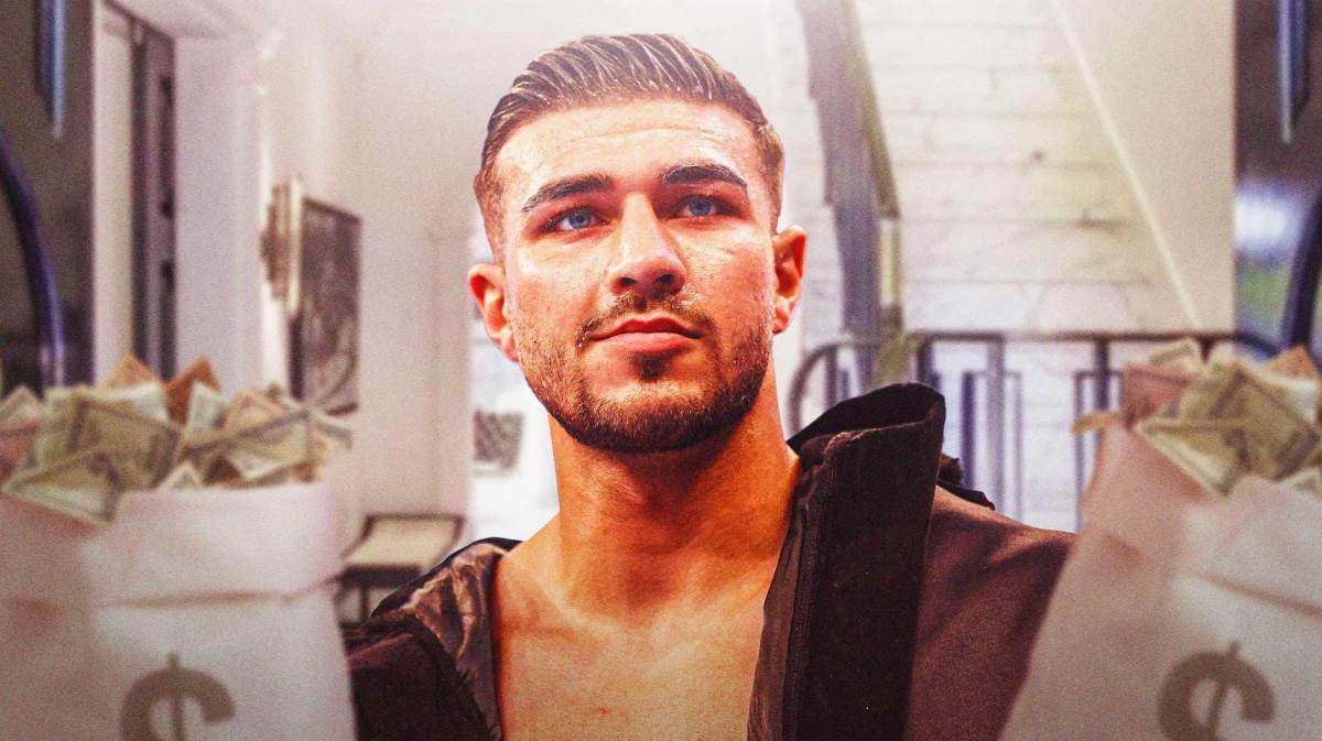 Tommy Fury in front of his mansion in England.