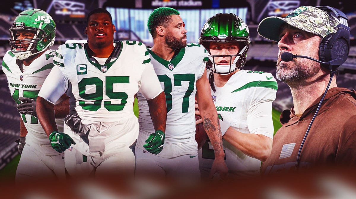 Aaron Rodgers wearing headset on sideline watching Zach Wilson, Garrett Wilson, C.J. Uzomah, Quinnen Williams at stadium in Las Vegas.