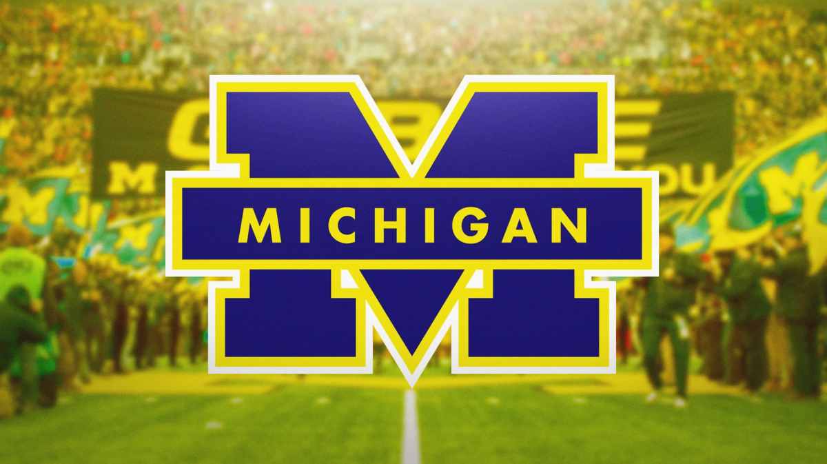 Michigan football, Wolverines, Michigan football minor, Michigan football investigation, Michigan football staff member fired, Michigan logo with Michigan football stadium in the background