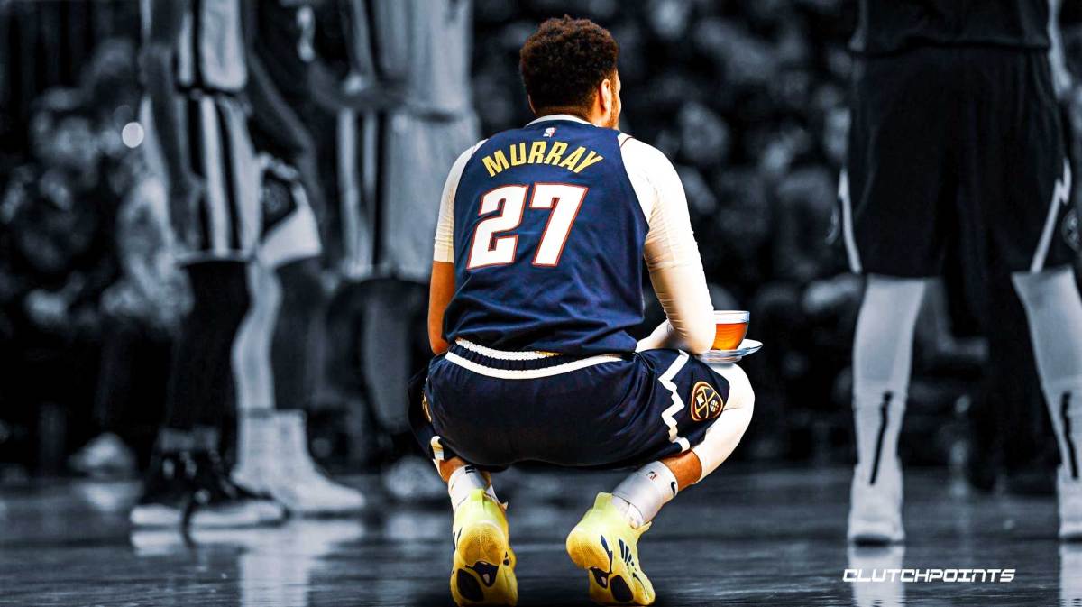 Nuggets' Jamal Murray sitting while looking sad