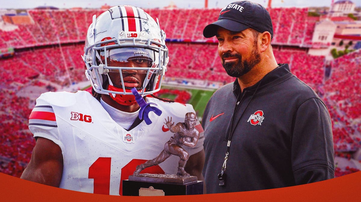 Photo: Marvin Harrison Jr. with the Hesiman trophy with Ryan Day in Ohio State gear next to him