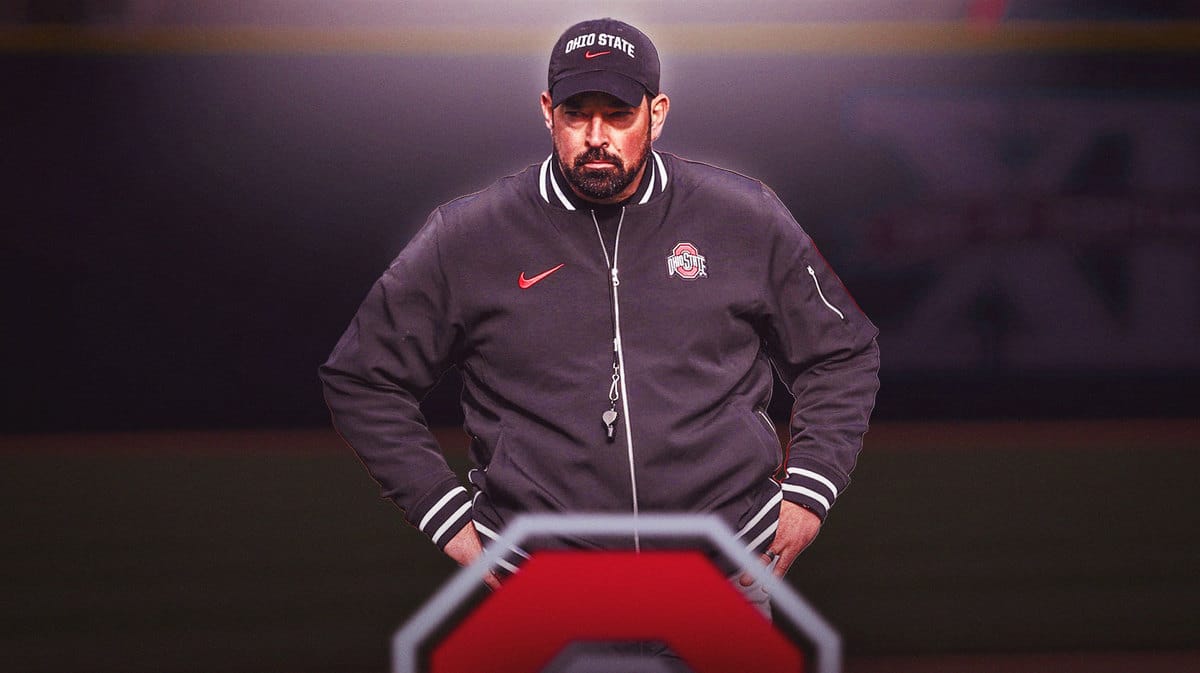 Ohio State coach Ryan Day standing on third base