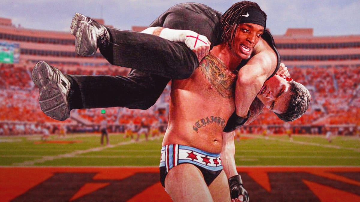 Ollie Gordon II of Oklahoma STATE football as the dude carrying here, and Dillon Gabriel of OKLAHOMA as the man being carried.
