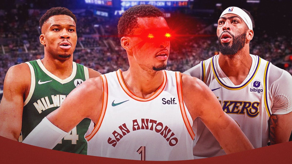 Victor Wembanyama of the Spurs with woke eyes in the middle of Giannis Antetokounmpo (Bucks) and Anthony Davis (Lakers)