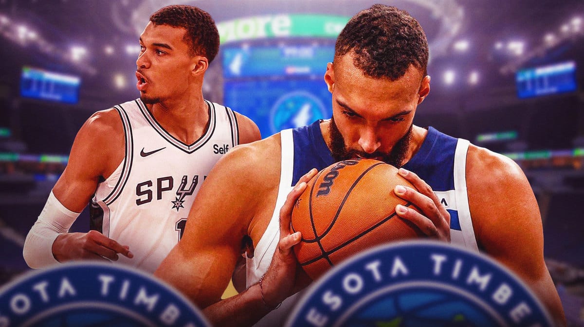 Minnesota Timberwolves center Rudy Gobert and San Antonio Spurs stat Victor Wembanyama in front of the Target Center.