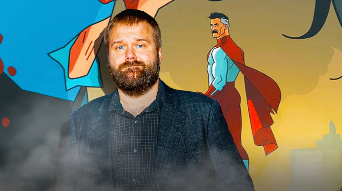 Robert Kirkman with scene from Invincible behind him.