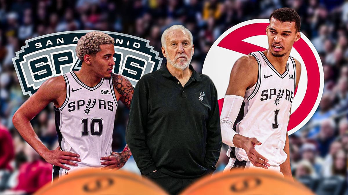 Jeremy Sochan and Victor Wembanyama on either side looking stern, Gregg Popovich in middle, Spurs and ATL Hawks logos, basketball court in background