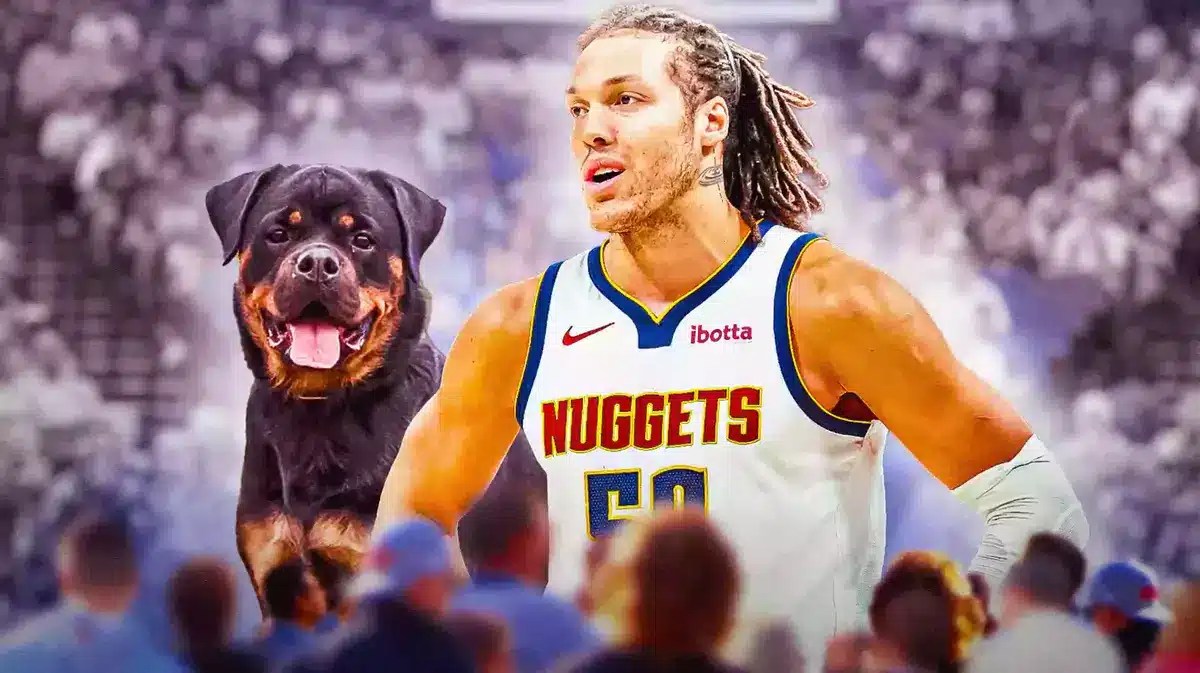 Denver Nuggets forward Aaron Gordon next to a Rottweiler