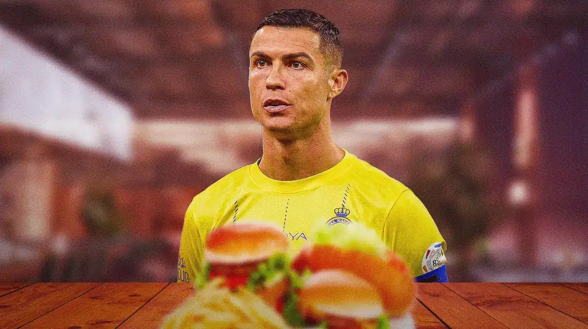 Cristiano Ronaldo sitting at a table of food