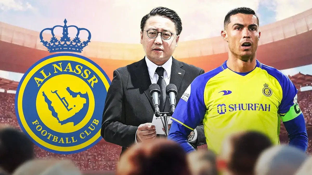 Kengo Oishi and Cristiano Ronaldo in front of the Al-Nassr logo