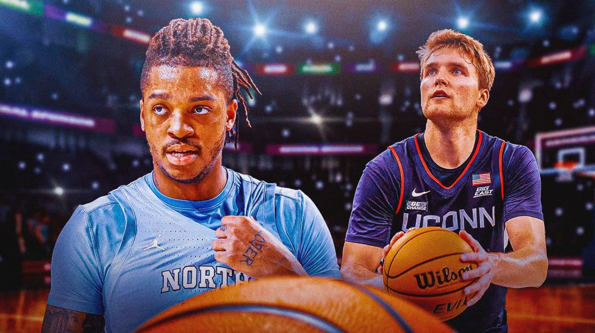 North Carolina basketball, Tar Heels, UConn basketball, Cam Spencer, Armando Bacot, Armando Bacot in UNC uni and Cam Spencer in UConn uni with UConn basketball arena in the background