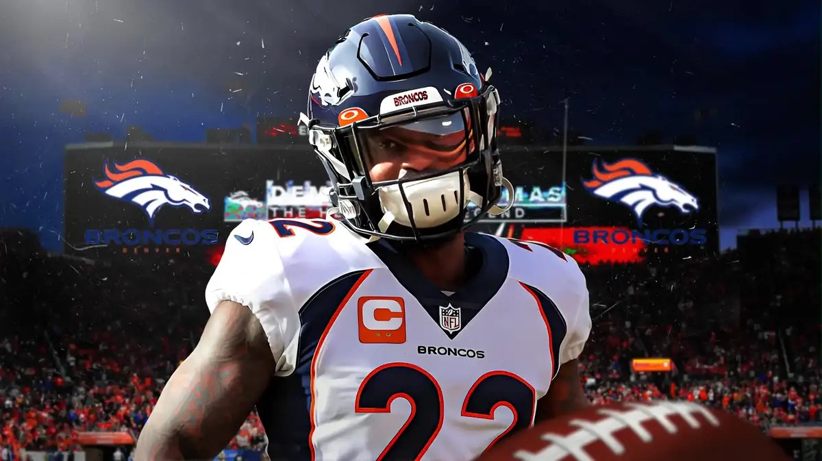 Kareem Jackson with a Broncos logo behind him