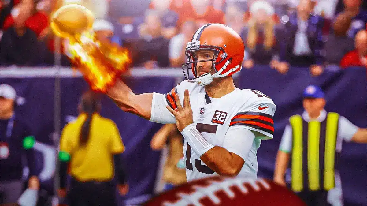 Joe Flacco throwing a pass with fire on his arm