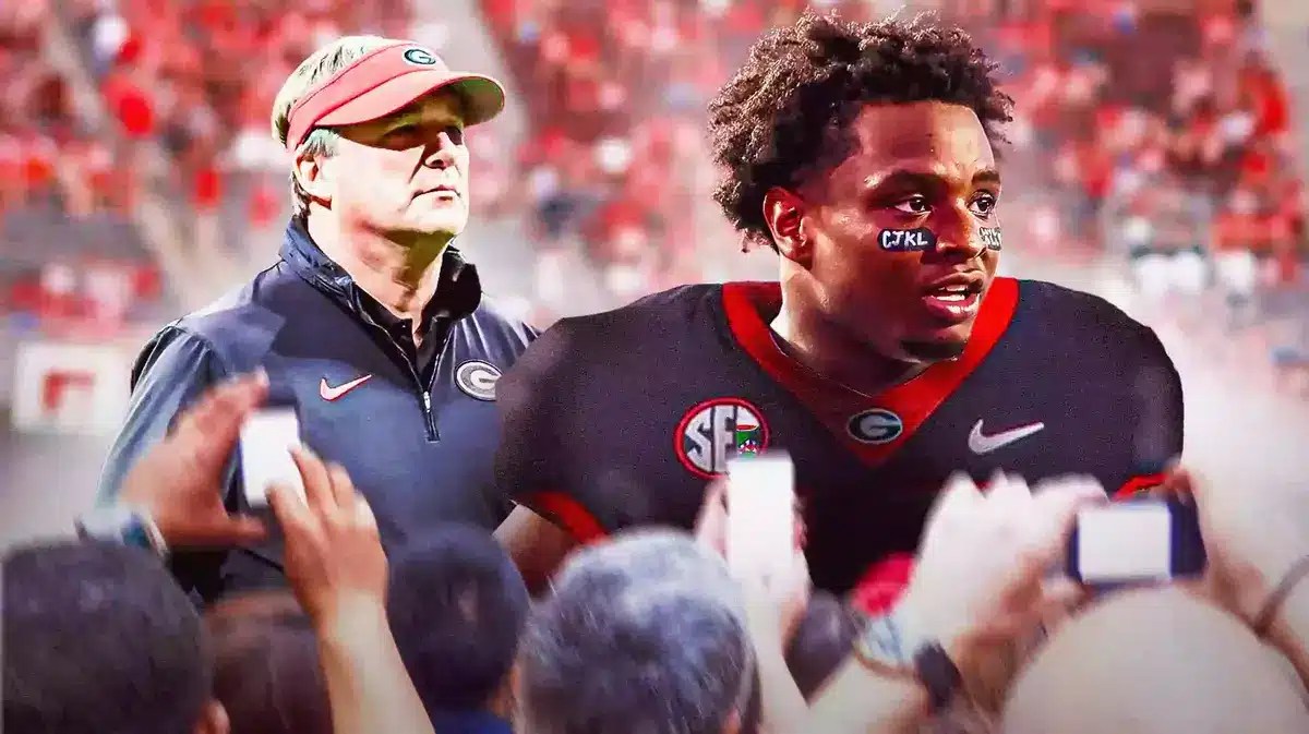 Photo: Trevor Etienne in Georgia jersey with Kirby Smart and Bulldogs fans behind them