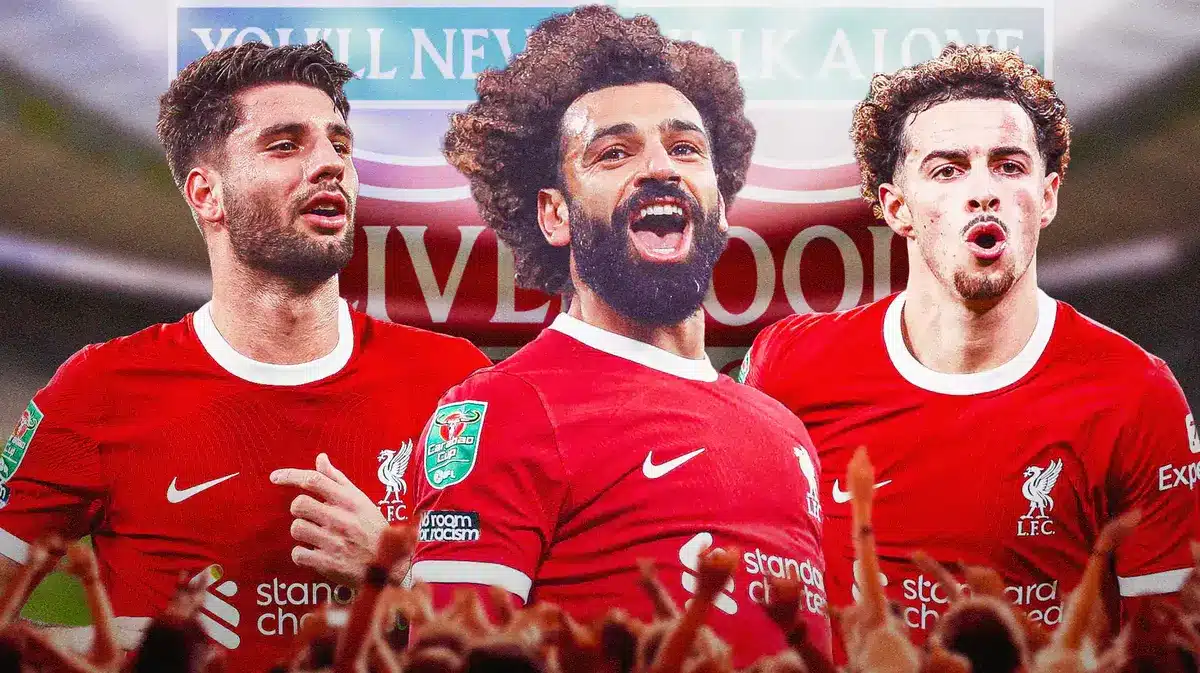 Dominik Szoboszlai, Mohamed Salah, Curtis Jones all celebrating in front of the Liverpool logo Carabao Cup