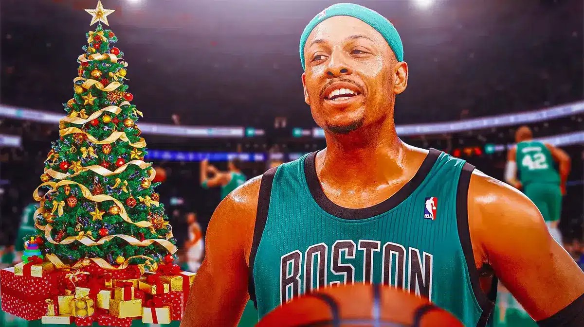 Paul Pierce in a Celtics uniform. Christmas tree next to him