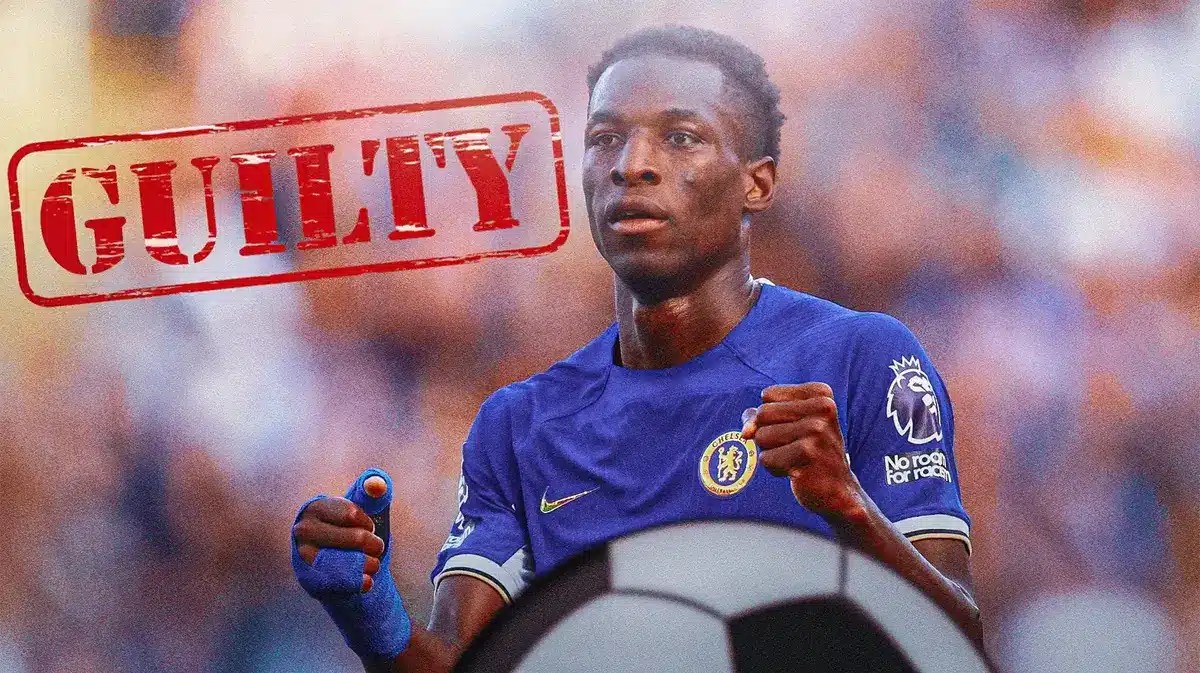 Nicholas Jackson in front of the Chelsea logo, a ‘guilty?’ sign in front of him